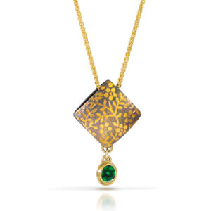 Gold diamond pillow pendant with flower pattern and emerald drop. Gold chain.