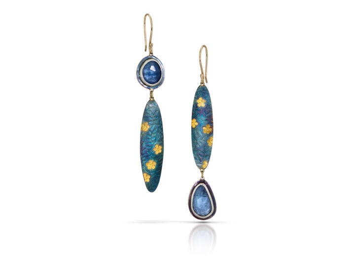 Aquamarine in long asymmetric earrings with blue and gold ovals
