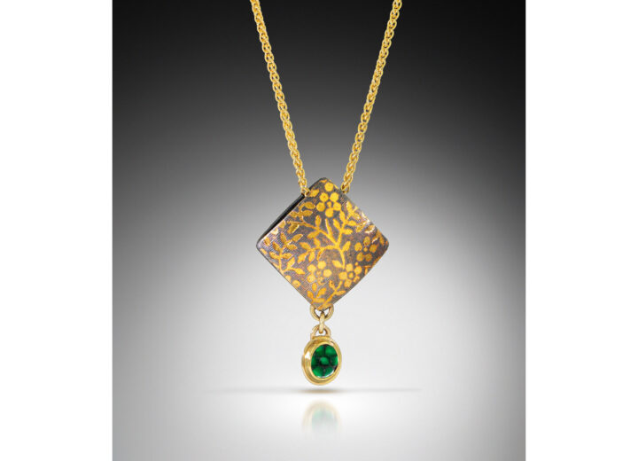 Square pillow pendant with gold flowers and small emerald drop