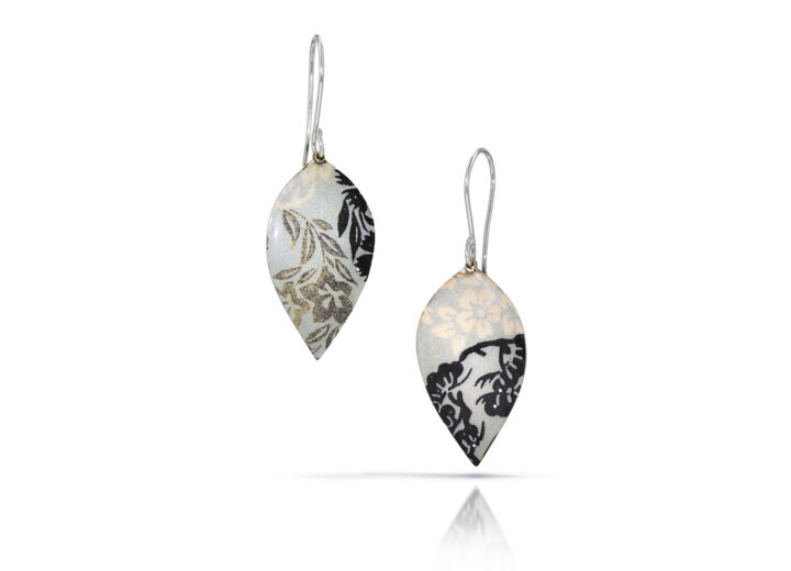 green black and cream flowers on petal shaped enamel earrings
