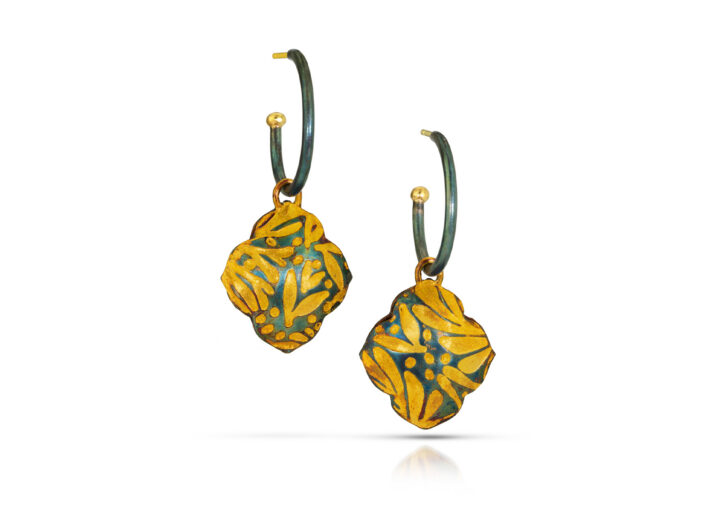 Black and gold hoops with fancy quatrefoil charms with gold floral pattern