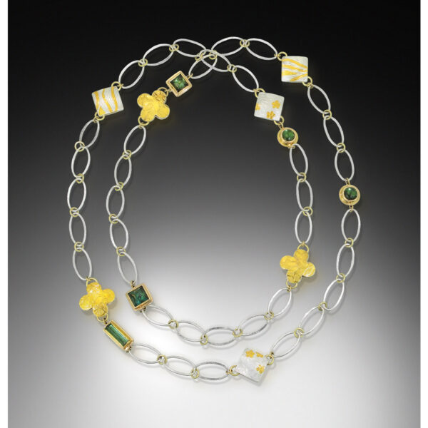 Long chain necklace with tourmaline and pillow charms in gold and silver