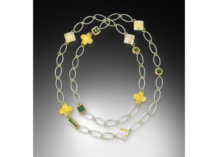 Long chain necklace with tourmaline and pillow charms in gold and silver