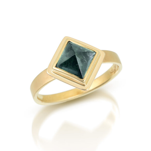 square green tourmaline in gold ring with forged flat band