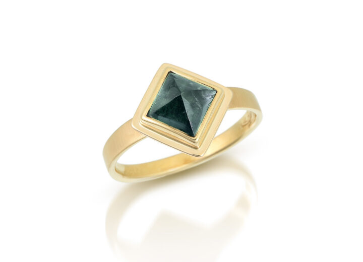 square green tourmaline in gold ring with forged flat band