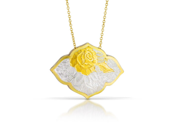 Horizontal fancy quatrefoil pendant with gold and silver rose pattern
